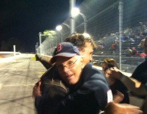 Car owner Charlie Banta (right) hugs driver Steve Kenneway after clinching the Limited Sportsman championship at Thompson Speedway last season