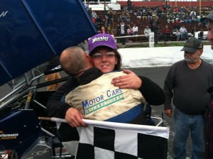 Bethany Stoehr is hugged by her father Greg after winning a NEMA Midget feature at the Waterford Speedbowl in Oct. 2013