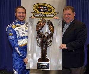 New Hampshire Motor Speedway executive vice president and general manager Jerry Gappens (right) presents 2013 Camping World RV Sales 301 winner Brian Vickers with his Loudon The Lobster Thursday in Charlotte (Photo: New Hampshire Motor Speedway)