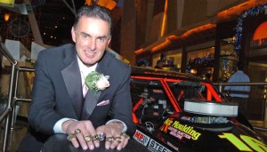 Mike Stefanik displays his NASCAR championship rings in 2006 (Photo: Howie Hodge for NASCAR)