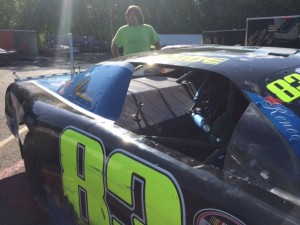 Chris Garside looks over his Late Model, that he's loaning to Keith Rocco tonight at the Waterford Speedbowl
