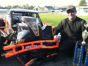 Dennis Perry in front of his car after a third place finish in Sunday's Bullring Bash 100 at Lee USA Speedway 
