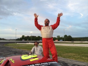 Glenn Boss celebrates at Late Model victory Thursday at Thompson Speedway 