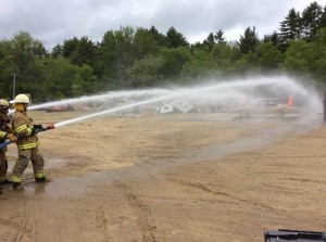 Sprint Cup Series driver Kasey Kahne takes part in firefighter training exercises Wednesday in Concord, N.H. (Photo: New Hampshire Motor Speedway)