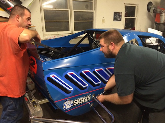 Joey Ferrigno (left) and Paul French go over some thoughts for car preparation. 