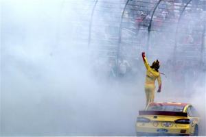 Joey Logano salutes fans at New Hampshire Motor Speedway after winning Sunday's Sprint Cup Series Sylvania 300 (Photo: Jerry Markland/Getty Images for NASCAR)