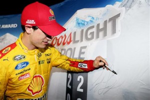 Joey Logano celebrates winning the pole for the Sprint Cup Series Friday at Atlanta Motor Speedway (Photo: Sarah Glenn/Getty Images for NASCAR)