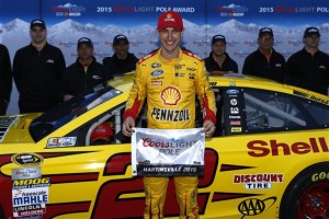Joey Logano celebrates winning the pole for the Sprint Cup Series STP 500 Friday at Martinsville Speedway (Photo: Jeff-Zelevansky/Getty Images for NASCAR)