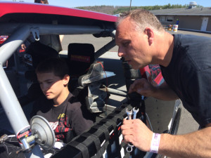 Marcello Rufrano (left) works with his dad, SK Modified team owner John Rufrano in the pits at Stafford Motor Speedway 