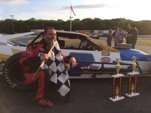 Chris Correll celebrates victory in the SK Light Modified feature at the New London-Waterford Speedbowl Saturday 