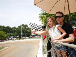 Jeff Gordon and his daughter Ella wave the checkered flag at Gordon's childhood race track, the Capitol Quarter Midget Association Dirt Track on June 20, 2015 in Rio Linda, California.  (Photo: Kelley L Cox/Getty Images for NASCAR)
