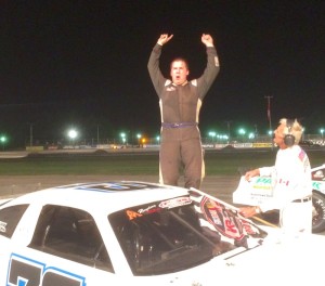 Joey Doiron celebrates victory Saturday at Beech Ridge Motor Speedway in Scarborough, Me. 