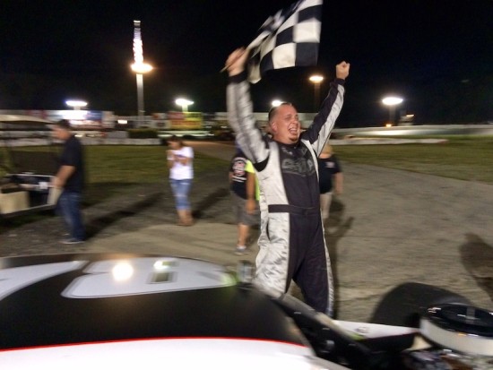 Diego Monahan celebrates victory in the SK Modified feature Saturday at the New London-Waterford Speedbowl 