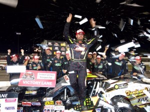 Doug Coby celebrates victory in the Whelen Modified Tour Budweiser 150 Wednesday at Thompson Speedway