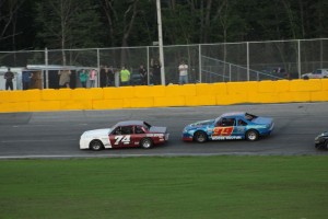 Joe Arena (74) and Chris Douton battle in North East Street Stock Tour action recently at Speedway 51 in Groveton, N.H. 