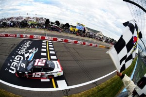 Joey Logano takes the checkered flag for victory in the XFINITY Series event Saturday at Watkins Glen International (Photo: Jared C. Tilton/Getty Images for NASCAR)