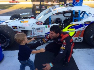 Keith Rocco is greeted in victory lane by his son KJ after winning the first SK Modified feature Wednesday at Thompson Speedway 