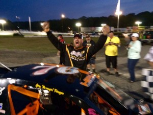 Paul French celebrates victory in the SK Light Modified feature Saturday at the New London-Waterford Speedbowl