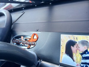 The inside of Michael Bennett's Late Model at Stafford Motor Speedway is adorned with a #RaceForChace decal and a photo of his 3-year old son Chace and his wife Lindsay