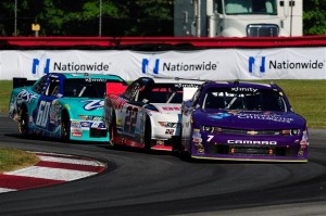 Regan Smith, driver of the #7, Alex Tagliani, driver of the #22 and Chris Buescher, driver of the #60, race during the XFINITY Series Nationwide Children's Hospital 200 at Mid-Ohio Sports Car Course on Sunday (Photo: Jeff Curry/Getty Images for NASCAR)