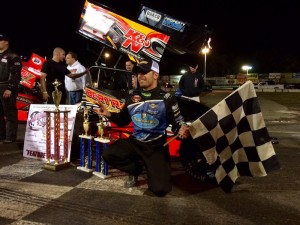 Doug Coby celebrates victory in the NEMA Midget feature Saturday at the New London-Waterford Speedbowl 