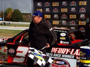 Corey Hutchings celebrates victory in the Limited Sportsman feature Sunday at Thompson Speedway 