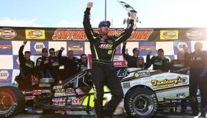 Doug Coby celebrates victory at the Whelen Modified Tour NAPA Fall Final 150 Sunday at Stafford Motor Speedway (Photo: Tim Bradbury/Getty Images for NASCAR)