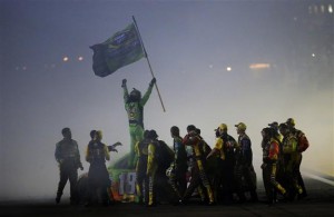 Kyle Busch celebrates victory and his first Sprint Cup Series championship after Sunday's Ford EcoBoost 400 at Homestead-Miami Speedway (Photo: Chris Trotman/Getty Images for NASCAR)