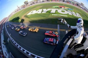 Denny Hamlin takes the checkered flag inches ahead of Martin Truex Jr. at the finish of the Daytona 500 in February (Photo: Chris Trotman/Getty Images for NASCAR) 