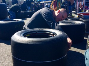 Jimmy Blewett measuring tires Saturday morning at Thompson Speedway. 
