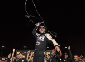 Bobby Santos III celebrates victory in the Whelen Modified Tour Thompson 125 Wednesday at Thompson Speedway (Photo: Michael Ivins/Getty Images for NASCAR) 