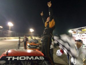 Glen Thomas Jr. celebrates victory in the North East Mini Stock feature Saturday at the New London-Waterford Speedbowl 