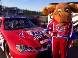 New Hampshire Motor Speedway mascot Milo the Moose kept guard over the track's show car Thursday 