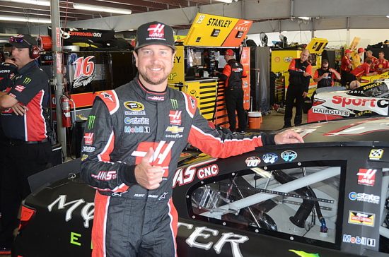 Sprint Cup Series driver Kurt Busch shows off the decal on his car memorializing 