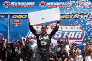 Bobby Santos III celebrates victory in the Whelen Modified Tour All-Star Shootout Friday at New Hampshire Motor Speedway: (Photo: Todd Warshaw/Getty Images for NASCAR)