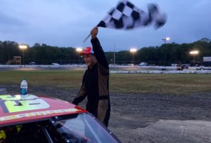 Corey Barry celebrates victory Saturday at the New London-Waterford Speedbowl 