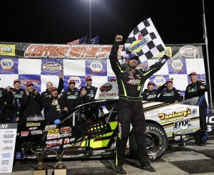 Doug Coby celebrates victory in the Whelen Modified Tour NAPA Fall Final 150 Sunday at Stafford Speedway (Photo: Getty Images for NASCAR) 
