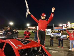 Matt Hirschman celebrates victory in the NorthEast Race Cars & Parts Tri-Track Open Modified Series event Sunday at the New London-Waterford Speedbowl 