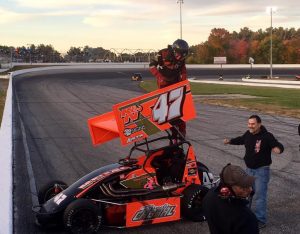 Randy Cabral celebrates victory in the Northeastern Midget Association feature Saturday at the Sunoco World Series at Thompson Speedway 