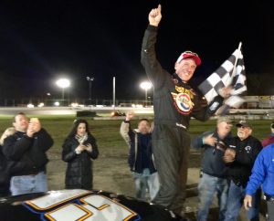 Ted Christopher celebrates Sunday evening at the New London-Waterford Speedbowl before a penalty stripped his team of victory in the SK Modified feature 